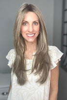 Woman wearing long layered platinum wig (Stay Out Late by Gabor in Shaded Cappuccino)