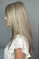 Woman wearing long layered platinum wig (Stay Out Late by Gabor in Shaded Cappuccino)