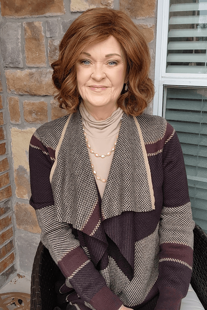 Woman wearing curly red bob wig (Gabor's In Bloom in Medium Red)