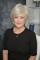Woman with chin-length blonde bob wig (Wonderful Wit by Gabor in Light Gray).