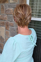 Woman wearing red pixie wig (Passion by Gabor in Light Red)