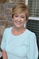 Woman wearing red pixie wig (Passion by Gabor in Light Red)