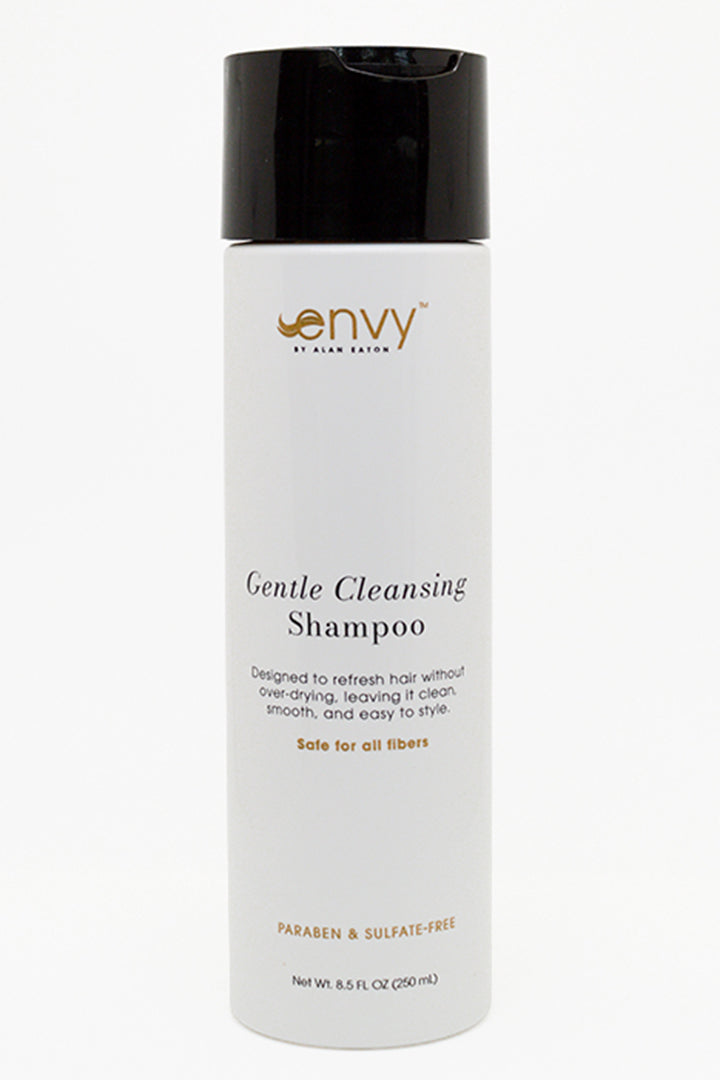 A white bottle of Envy Gentle Cleansing Shampoo with a black flip-top cap, shown against a plain white background.