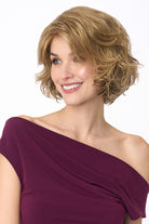 Gia Mono synthetic wavy bob wig in a light brown shade with a natural lace front and monofilament top.