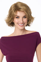 Gia Mono synthetic wavy bob wig with a lace front and monofilament top in a natural light brown shade.