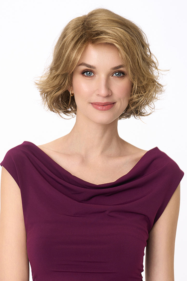 Gia Mono by Envy synthetic wavy bob wig in a light brown shade with a natural lace front and monofilament top.