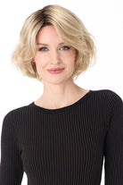Gia by Envy chin-length blonde bob wig with textured layers and a natural, voluminous synthetic style.