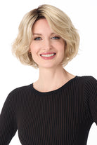 Gia by Envy synthetic chin-length blonde bob wig with textured layers and a modern, voluminous silhouette.