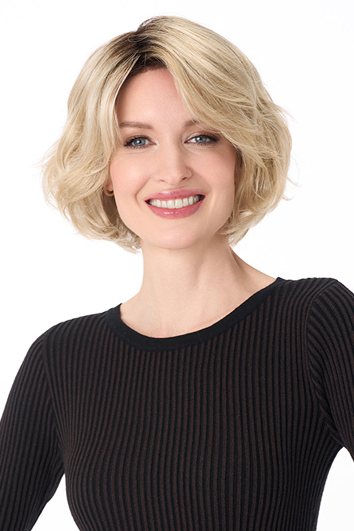 Gia by Envy synthetic chin-length blonde bob wig with textured layers and a modern, voluminous silhouette.