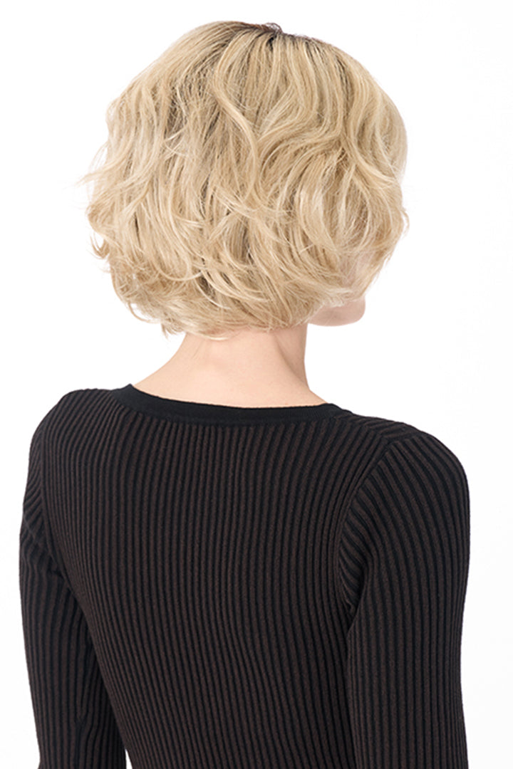 Back view of a chin-length, textured blonde bob synthetic wig with soft waves and volume.