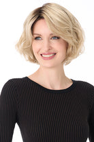 Gia by Envy chin-length blonde synthetic bob wig with textured layers and a natural, voluminous silhouette.