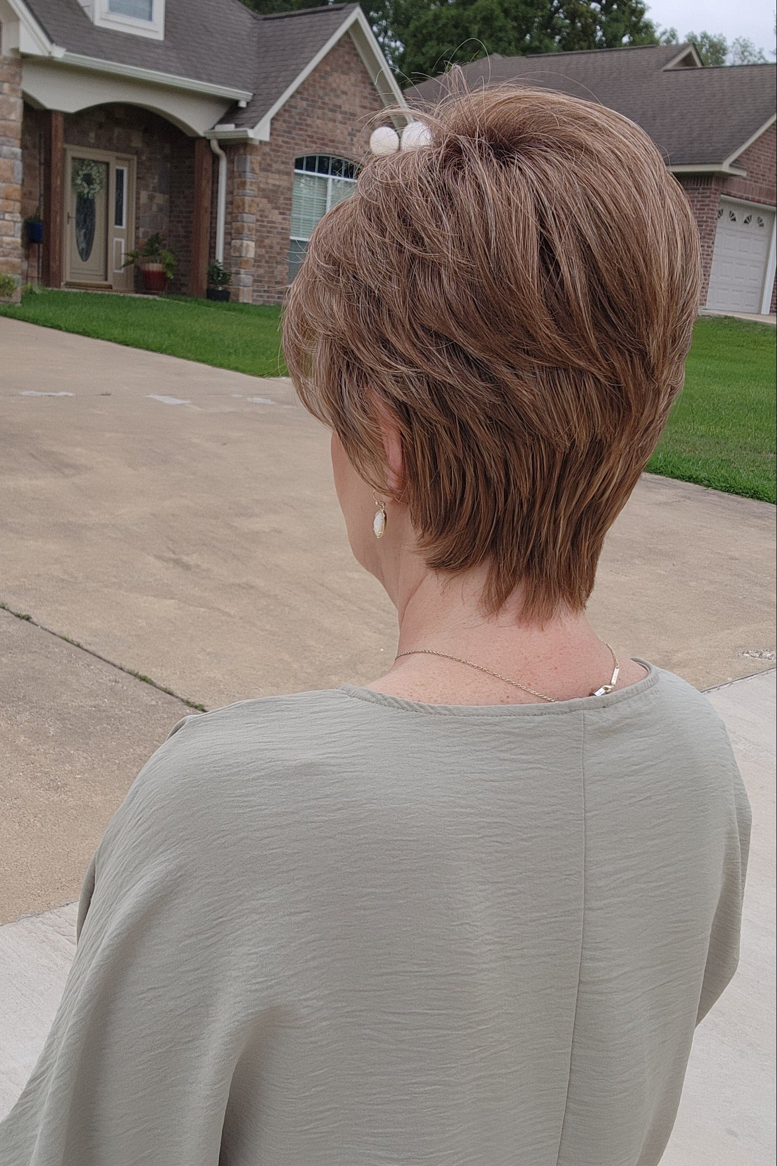 Woman wearing short auburn pixie wig (Pebbles by Henry Margu in 8/27/26HR)