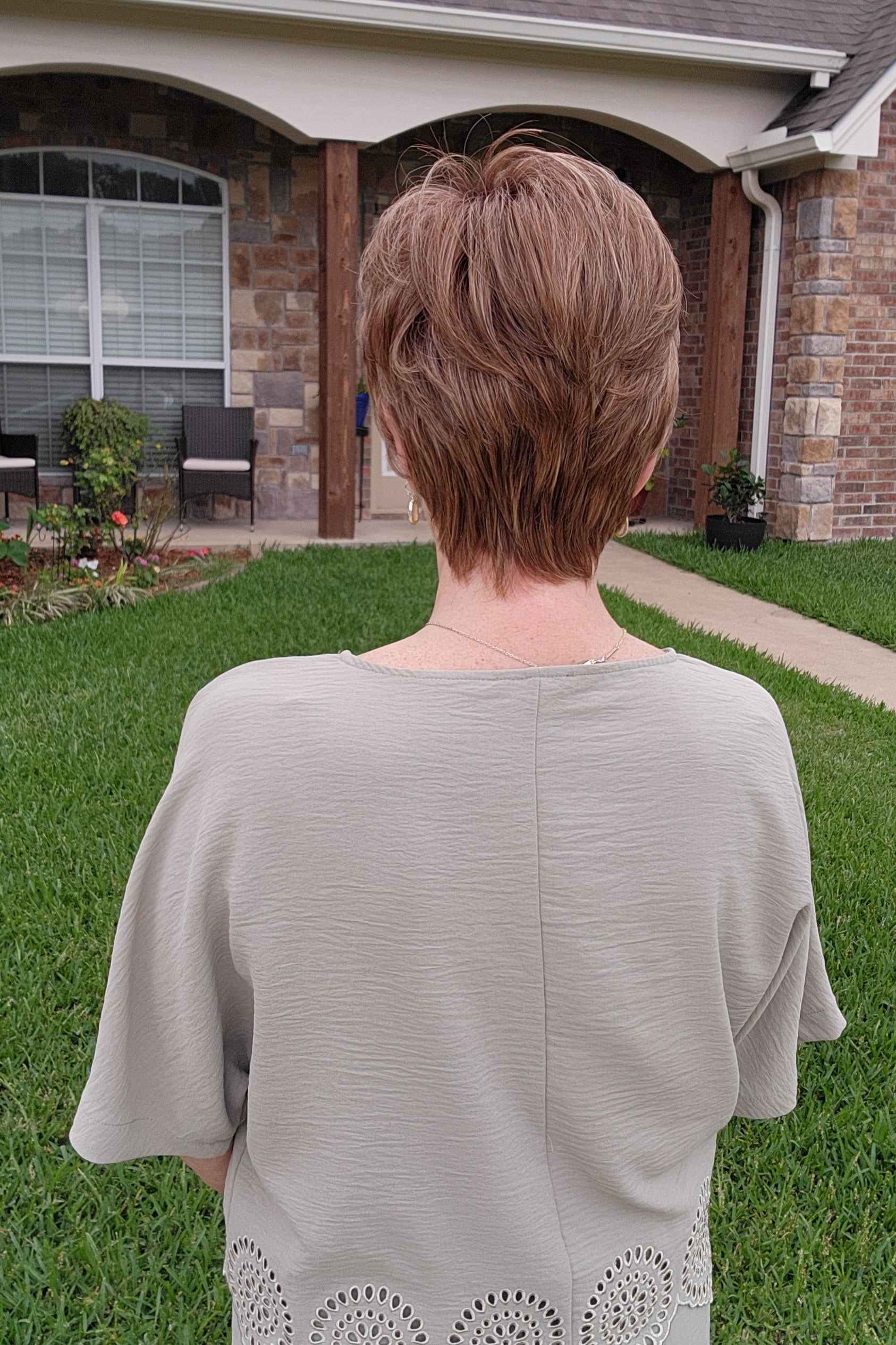 Woman wearing short auburn pixie wig (Pebbles by Henry Margu in 8/27/26HR)