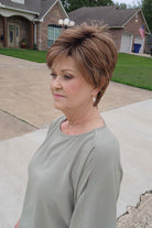 Woman wearing short auburn pixie wig (Pebbles by Henry Margu in 8/27/26HR)