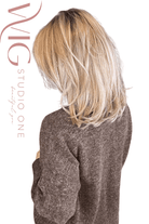 Woman wearing layered blonde rooted shoulder length wig (Henry Margu's London in 26GR)