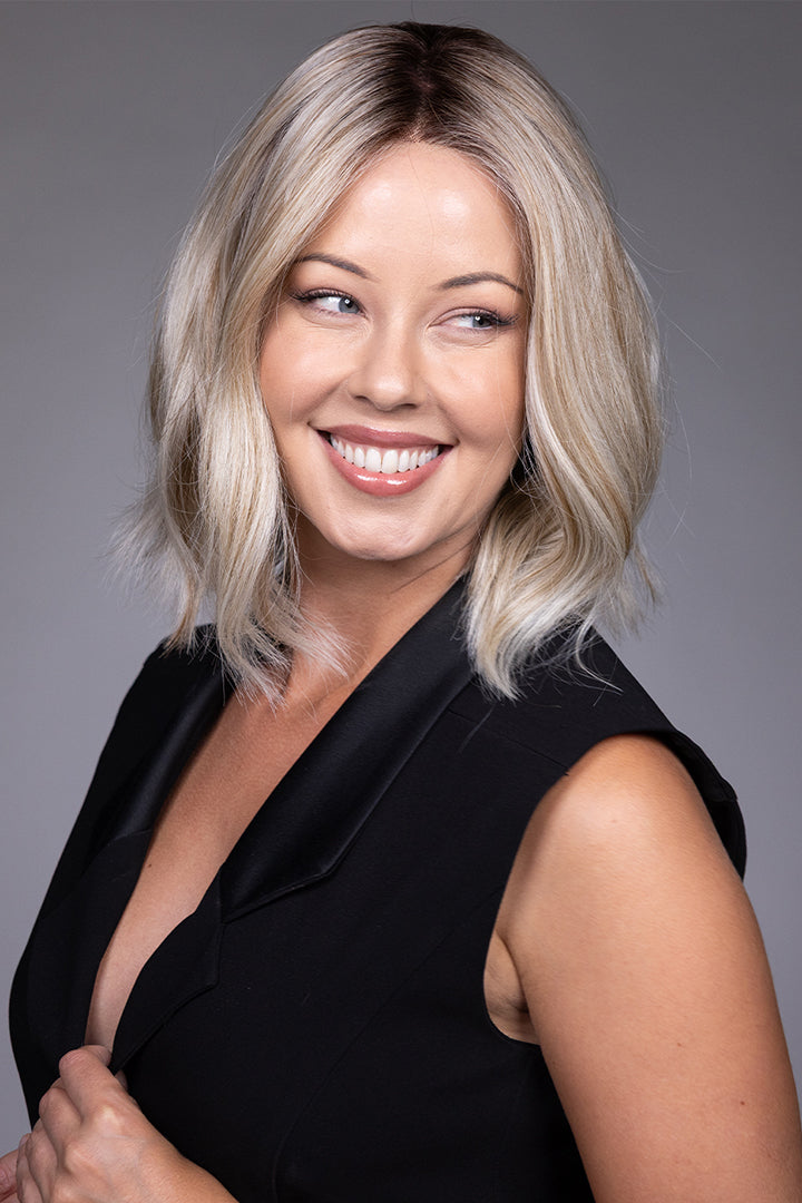 Indie by Belle Tress shoulder-length blonde bob wig with lace front and natural textured layers.