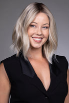 Indie by Belle Tress shoulder-length blonde bob wig with a natural lace front and textured layers.