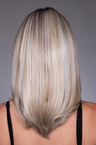 Back view of Jasmine by Belle Tress, a shoulder-length, layered blonde synthetic wig with a sleek, straight style.