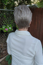 Woman wearing short gray pixie wig (Celine by Jon Renau in Oyster)