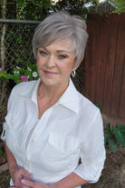 Woman wearing short gray pixie wig (Celine by Jon Renau in Oyster)