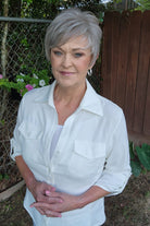 Woman wearing short gray pixie wig (Celine by Jon Renau in Oyster)