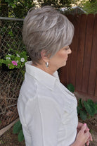 Woman wearing short gray pixie wig (Celine by Jon Renau in Oyster)