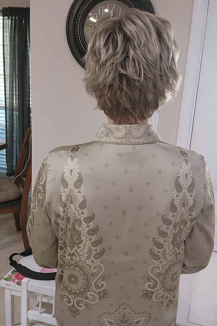 Woman wearing cropped pixie wig (Jon Renau's Chelsea in color Shaded Praline) back