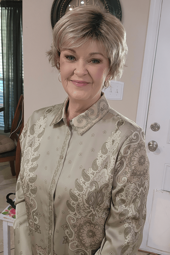 Woman wearing cropped pixie wig (Jon Renau's Chelsea in color Shaded Praline)