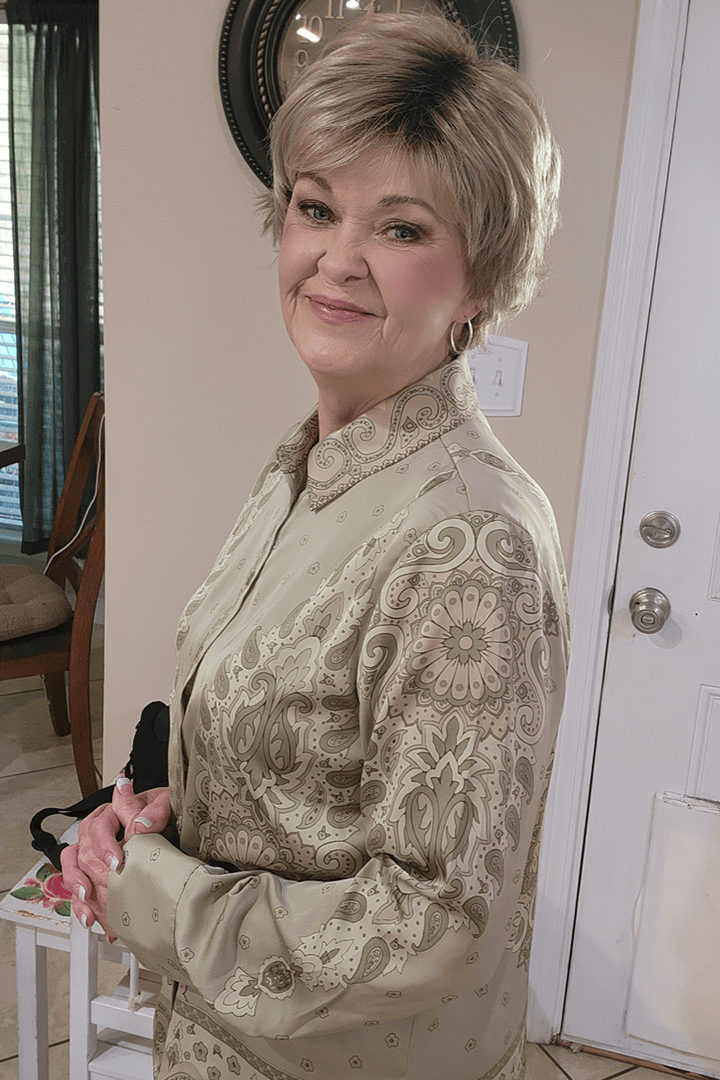 Woman wearing cropped pixie wig (Jon Renau's Chelsea in color Shaded Praline)