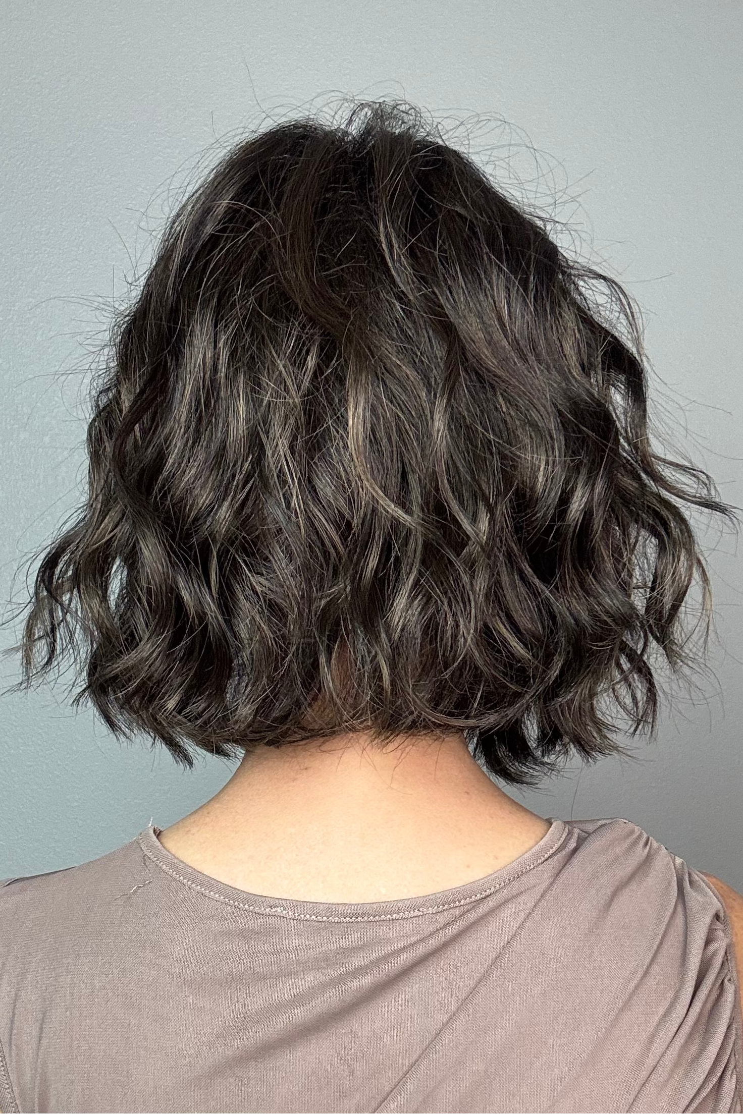 A woman with short dark brown wig (January by Jon Renau in color Mocha Latte R)