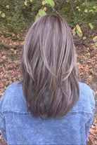 A woman with straight brown wig (Drew by Jon Renau in color Toasted Almond).