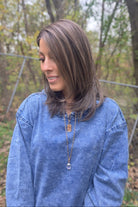 A woman with straight brown wig (Drew by Jon Renau in color Toasted Almond).