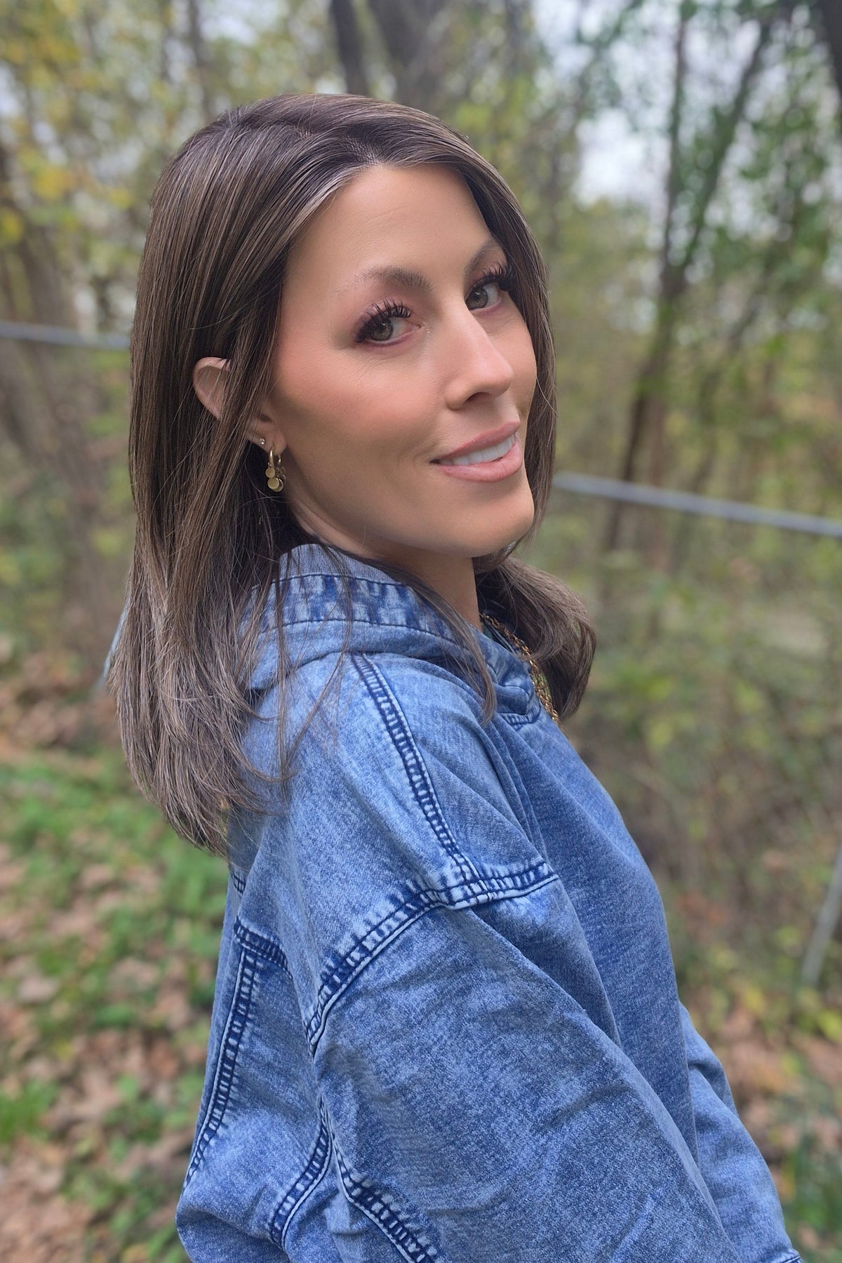 A woman with straight brown wig (Drew by Jon Renau in color Toasted Almond).