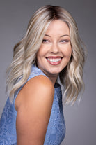 Karlie by Belle Tress mid-length wavy blonde synthetic wig with a natural lace front and monofilament top.