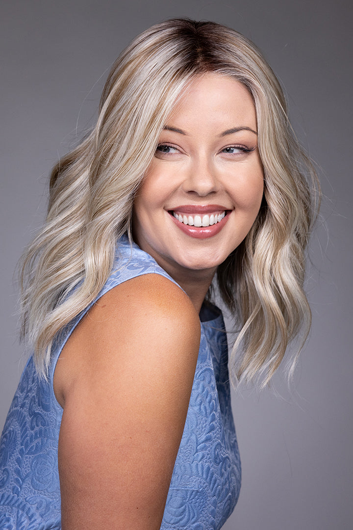 Karlie by Belle Tress mid-length wavy blonde synthetic wig with a natural lace front and monofilament top.