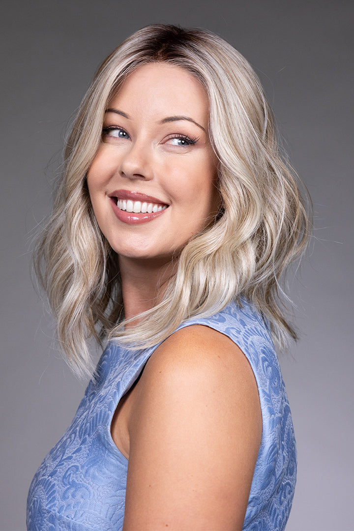 Karlie by Belle Tress mid-length synthetic wavy blonde wig with a natural lace front and monofilament top.