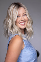 Karlie by Belle Tress mid-length wavy blonde synthetic wig with a natural lace front and monofilament top.