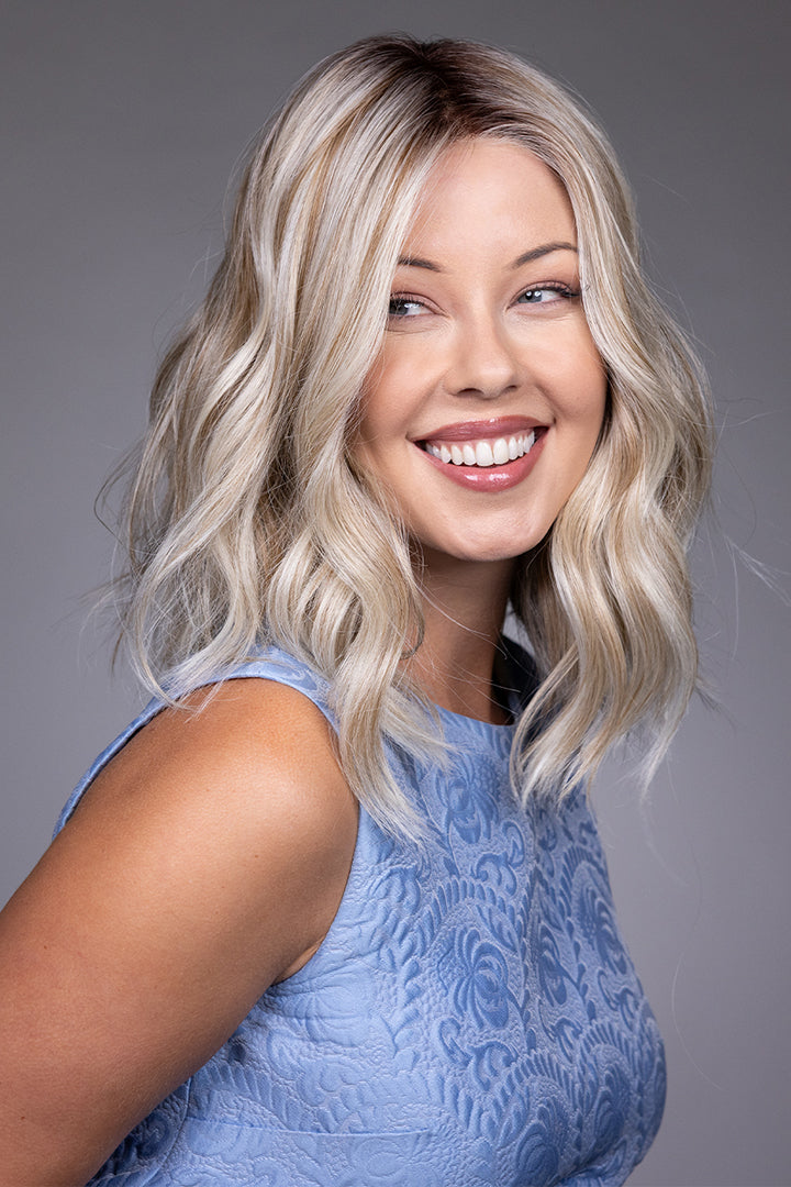 Karlie by Belle Tress mid-length wavy blonde synthetic wig with a natural lace front and monofilament top.