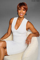 Model is wearing Kessie wig by Kim Kimble in MC30-130SS Cherry Cola | Front sitting down