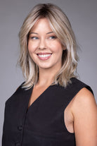 Woman wearing Monaco wig by Belle Tress in Milkshake Blonde R | Front looking off to side