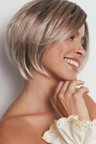 Maggie synthetic lace front bob wig in a highlighted blonde shade with tousled, shattered layers and a tapered nape.