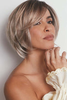 Maggie synthetic lace front bob wig in a highlighted ash blonde shade with tousled, shattered layers.