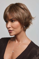 Mio by Noriko short layered synthetic pixie wig in a light brown shade with a natural lace front and monofilament part.