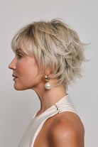 Mio by Noriko short blonde layered pixie wig with a lace front and side-swept fringe, shown in profile.
