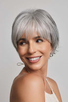 Mio by Noriko short, layered silver-grey synthetic pixie wig with a natural lace front and soft fringe.