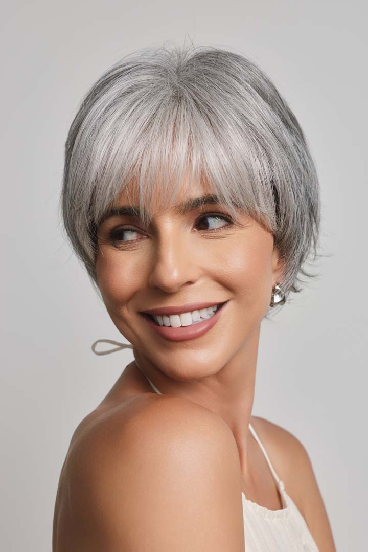 Mio by Noriko short, layered silver-grey synthetic pixie wig with a natural lace front and soft fringe.