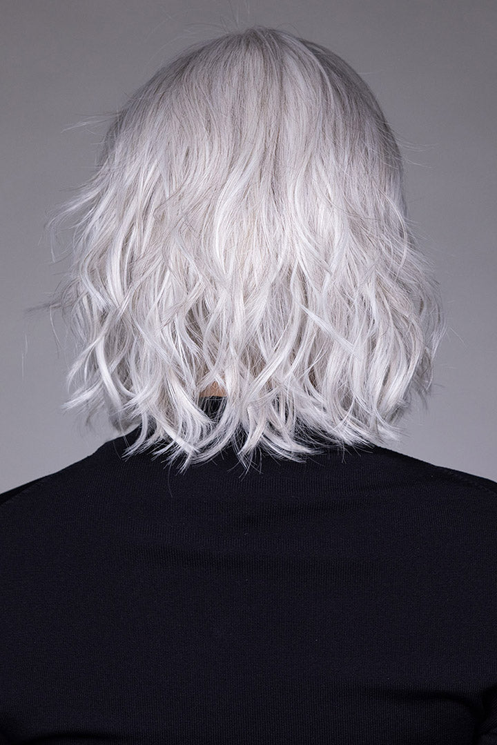 Woman wearing Naples wig by Belle Tress in Oyster Gray | Back