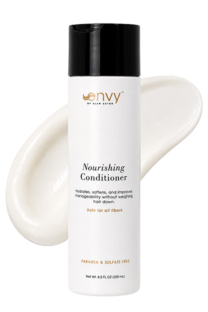 White 8.5 oz bottle of Envy Nourishing Conditioner with a black cap and a creamy white product swatch behind it.