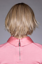 Woman wearing Oslo by Belle Tress in Raw Sugar Blonde R | Back, in pink shirt