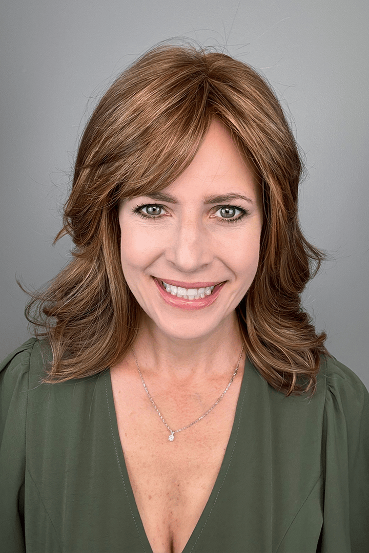 Woman wearing shoulder length brunette wig with bangs (Raquel Welch's On My Way wig in color Honey Toast)